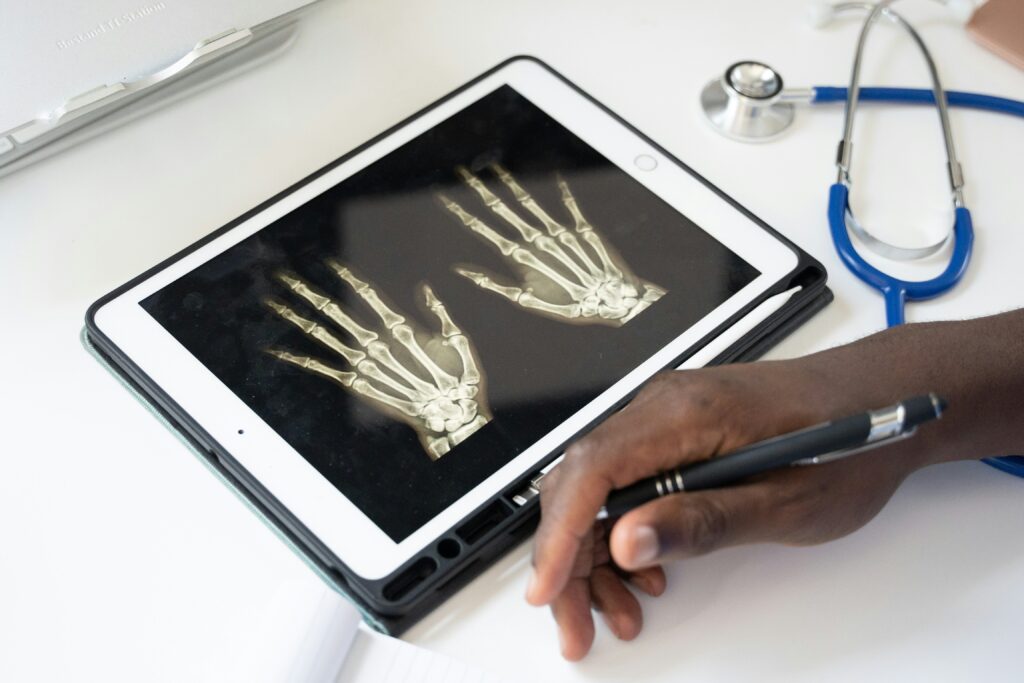Doctor reviewing a digital hand X-ray on a tablet at Nuvanta Family Hospital in Ghaziabad.